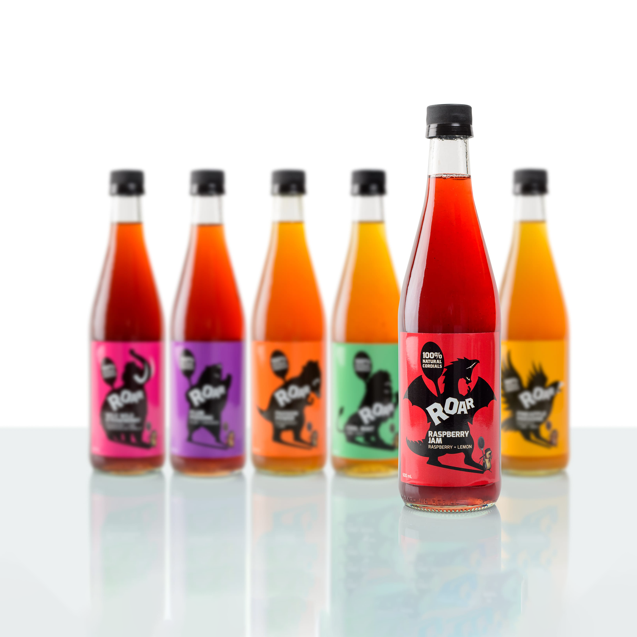 Group photo of Roar Living 100% natural cordial collection with raspberry cordial standing out